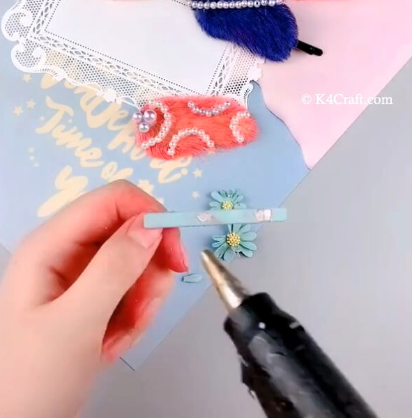Attaching the decorated seed to the hair clip