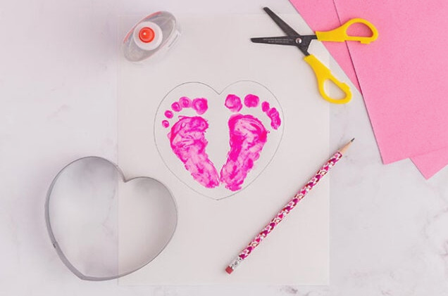 Place a heart shape around the prints