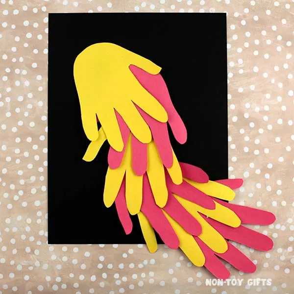 glue the handprints on black paper