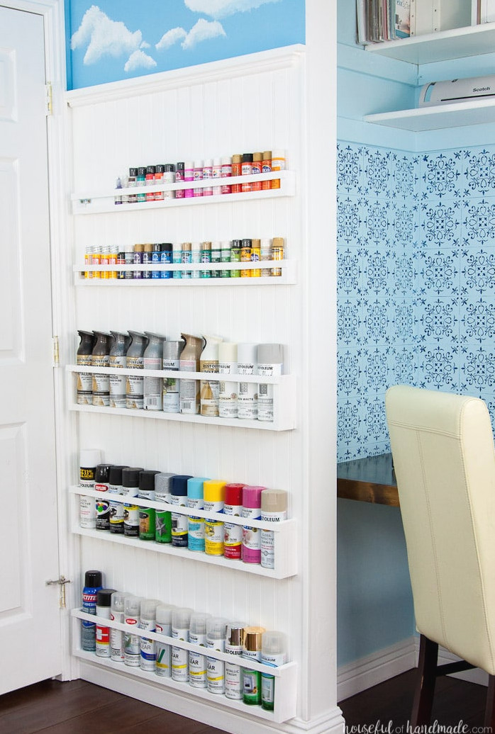 Build the ideal DIY paint organizer using leftover materials or inexpensive lumber. These paint shelves can also be mounted inside closets or behind doors, creating even more free space. Housefulofhandamde.com | $100 Room Challenge | Spray Paint Organizer | Craft Paint Storage | Craft Space Organization | Scrap Wood Project Plans | Free Building Plans | DIY Storage Ideas | Craft Room Transformation | Office Makeover