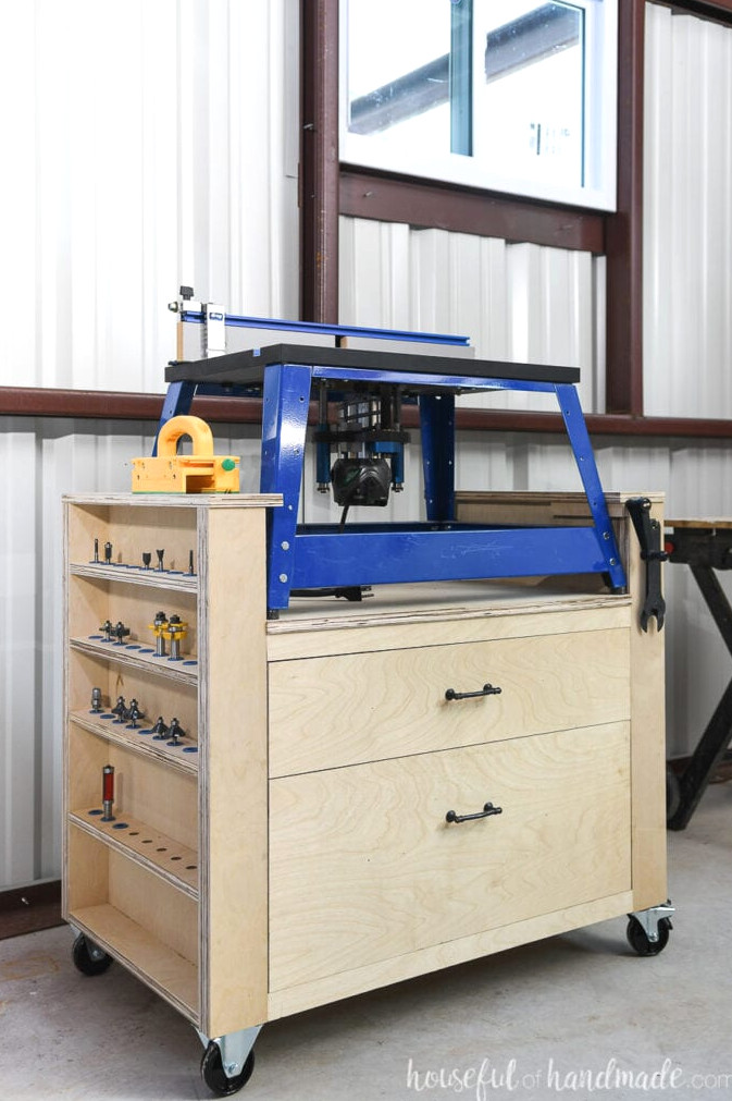 Plywood bench top router table stand featuring router bit storage on one side and 2 spacious drawers in the middle.