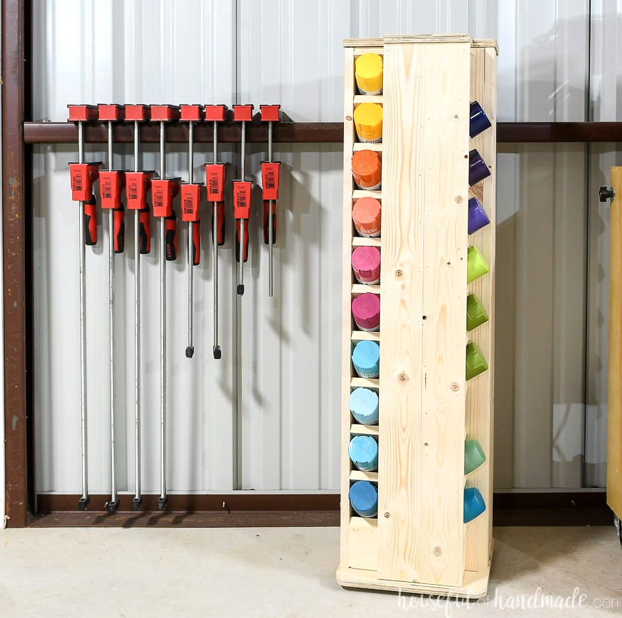 Woodworking shop featuring a rotating spray paint storage cabinet in the corner, holding 40 spray paint cans.