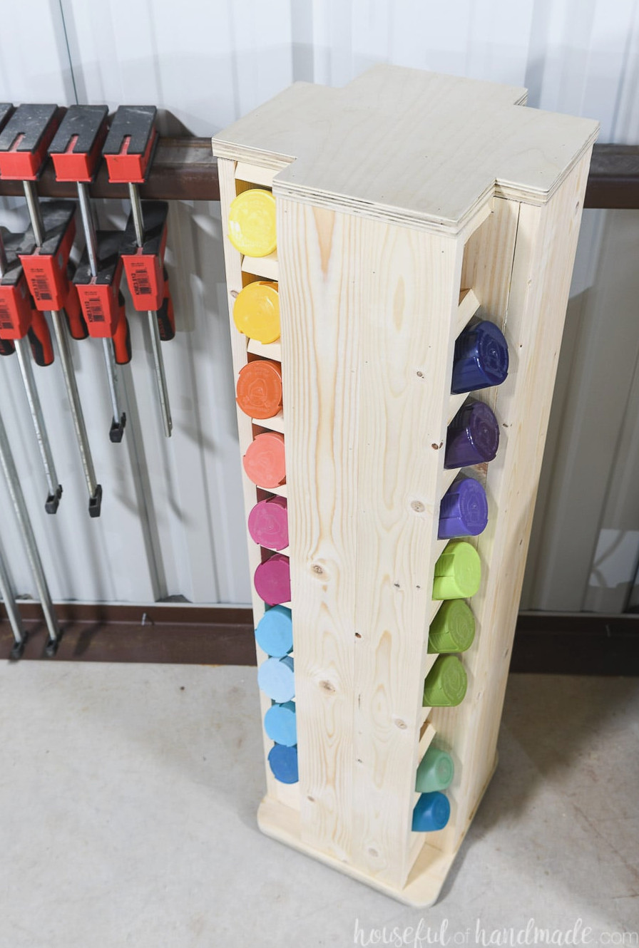 View from above the spray paint cabinet, showing 20 of the 40 cans it stores arranged by color.