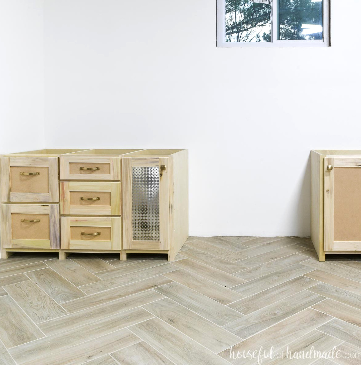 The remaining half of the built-in desk cabinets, including space for a PC stack.