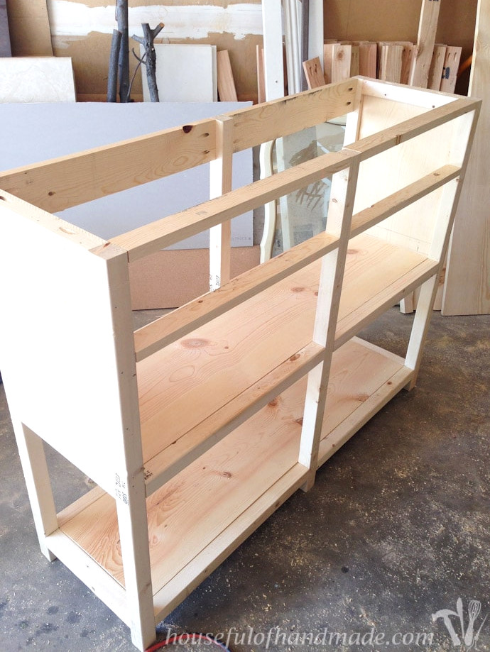 The back support pieces attached to the top between the back leg.
