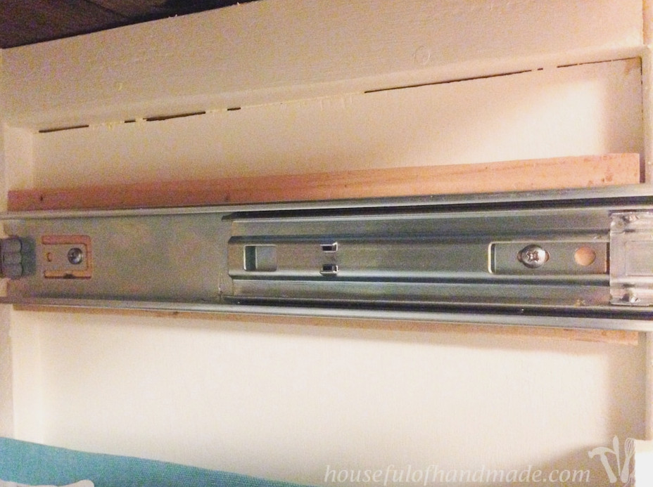 Showing the 1x board attached inside the coffee station table to attach drawer slides.