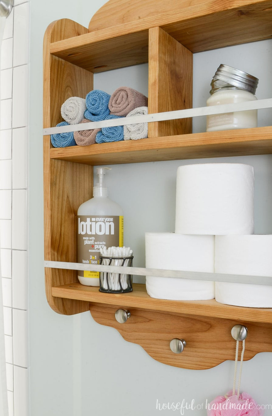 Farmhouse bathroom storage shelf that adds valuable space to a small bathroom.