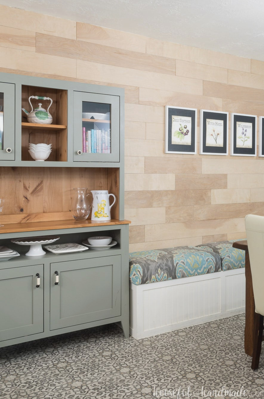Dining room bench beside a modern farmhouse hutch in the dining area. 
