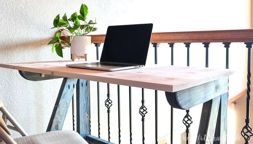 Detailed image of the folding desk surface.