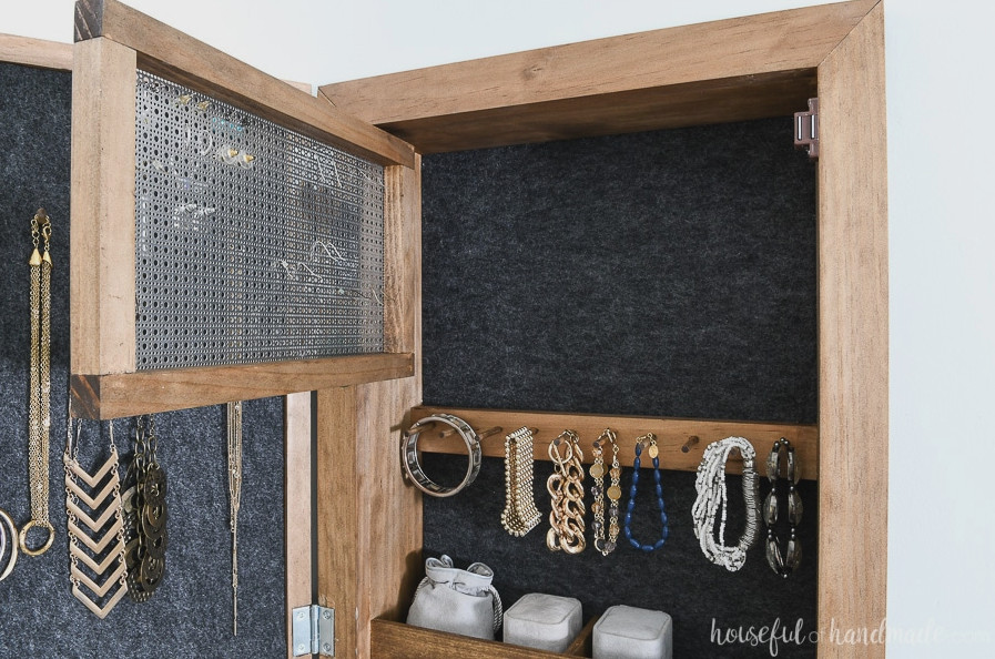 The back view of the hinged earring rack in the DIY wall jewelry organizer.