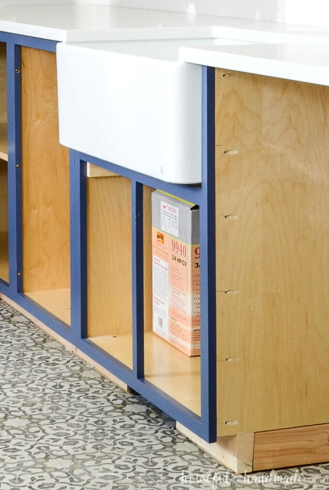 DIY kitchen cabinet installed with a farmhouse sink.