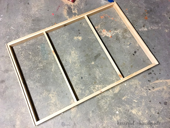Create the perfect place to organize your most used supplies! Learn how to hang pegboard so it is removable if needed. Housefulofhandmade.com | Craft organization ideas | Craft room remodel | Pegboard organization | $100 Room Challenge | Easy woodworking | Easy building plans | Free Building plans