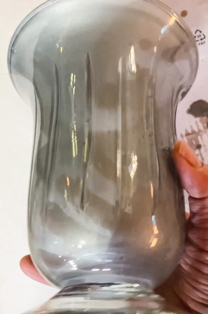 hand holding a vase