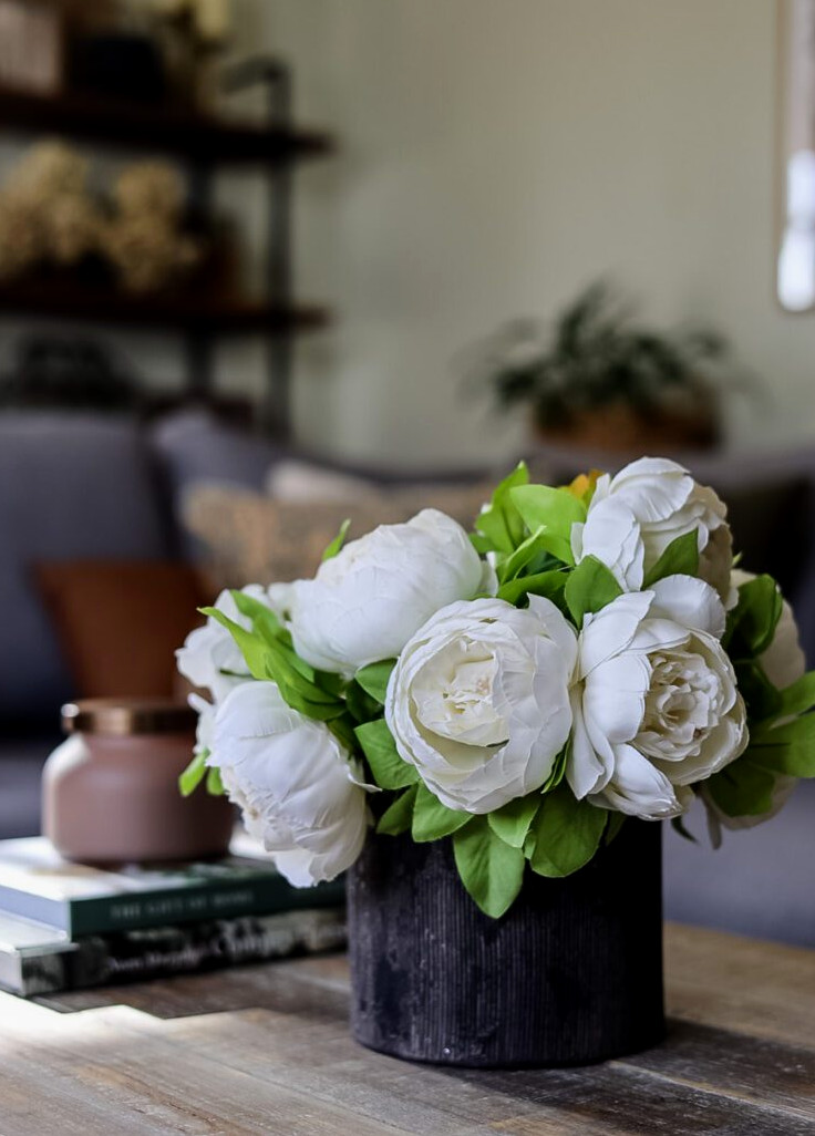 white artificial peonies in planter