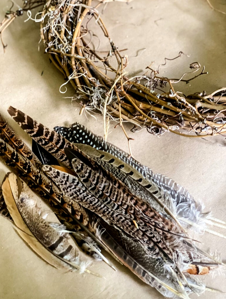 assorted feathers and a wreath