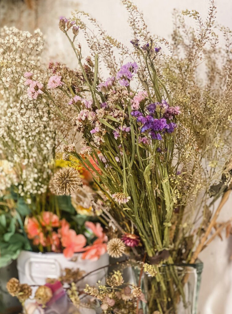 containers of dried flowers
