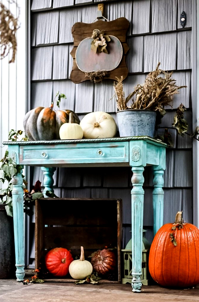 blue table with pumpkins