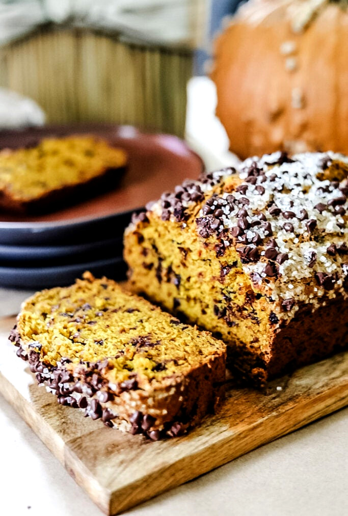 Chocolate Chip Pumpkin Bread on a cutting board sliced