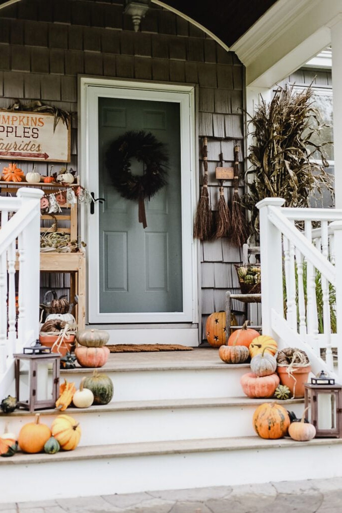 front porch with pumpkins