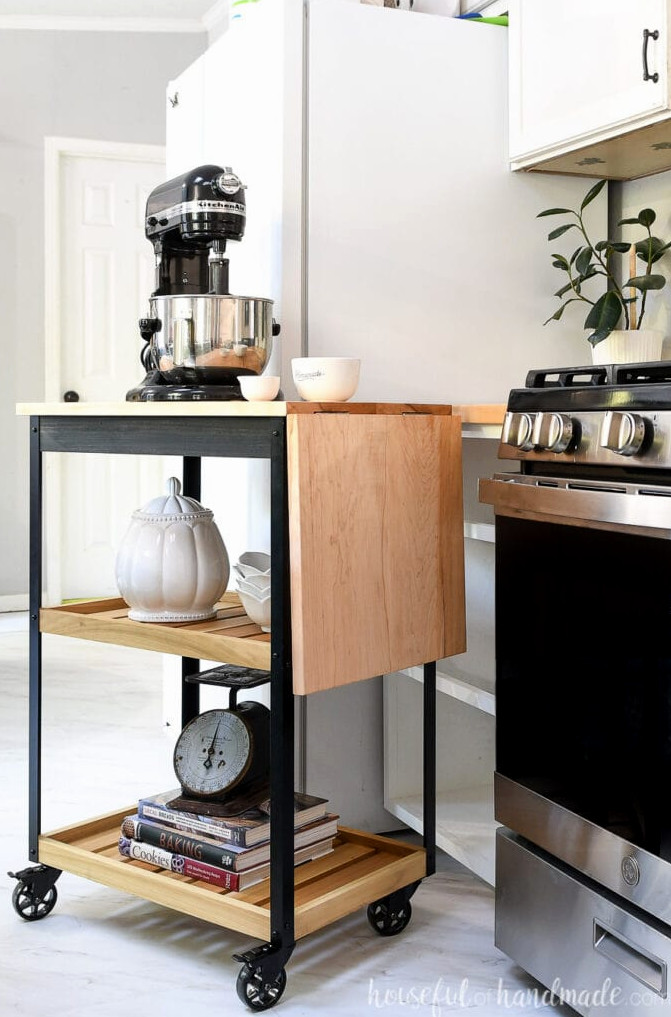 Side view of the rolling kitchen cart with the leaf lowered.