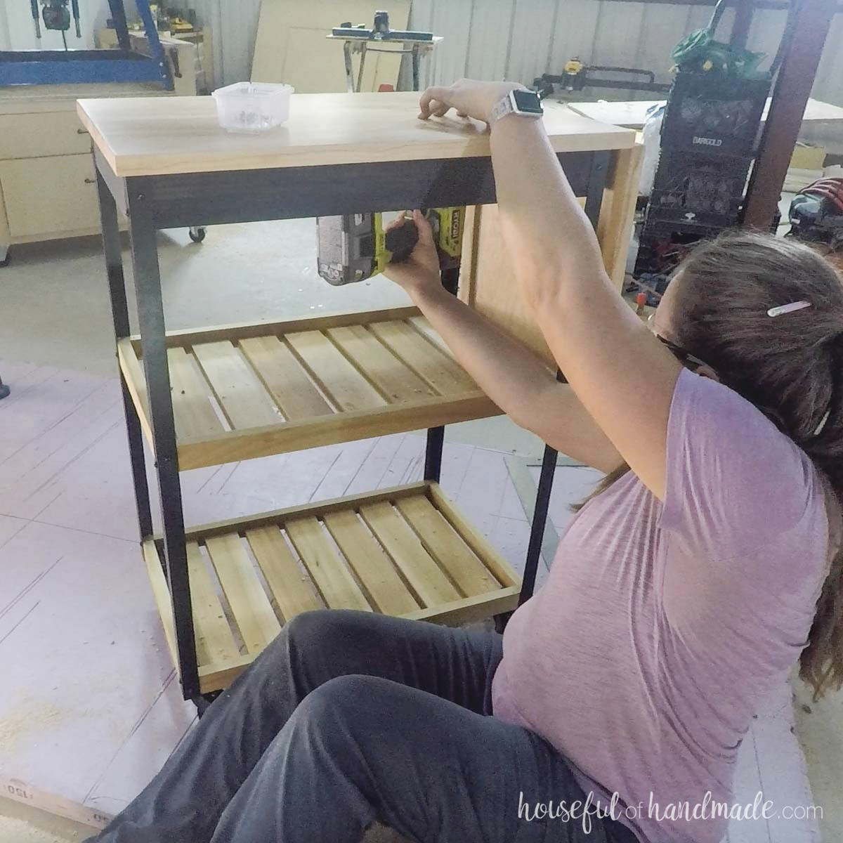 Attaching the top to the cart with figure 8 fasteners.