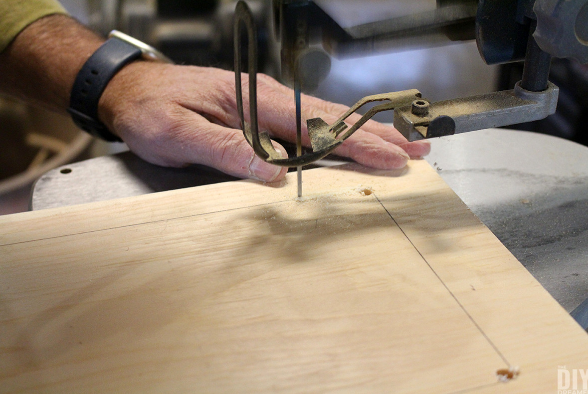 Cutting out the template with a scroll saw.