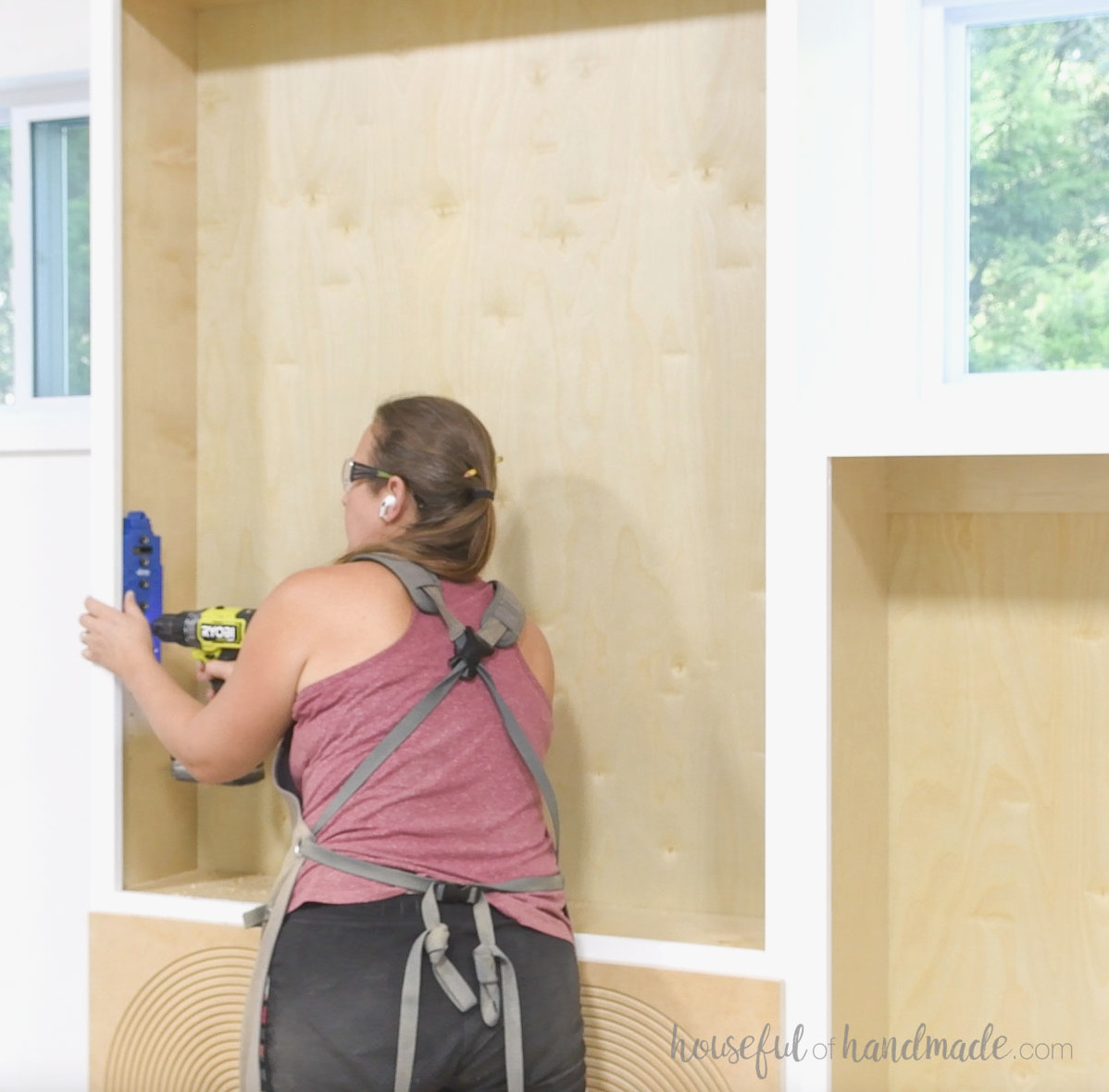 Drilling holes for shelf pins with a Kreg shelf pin jig.