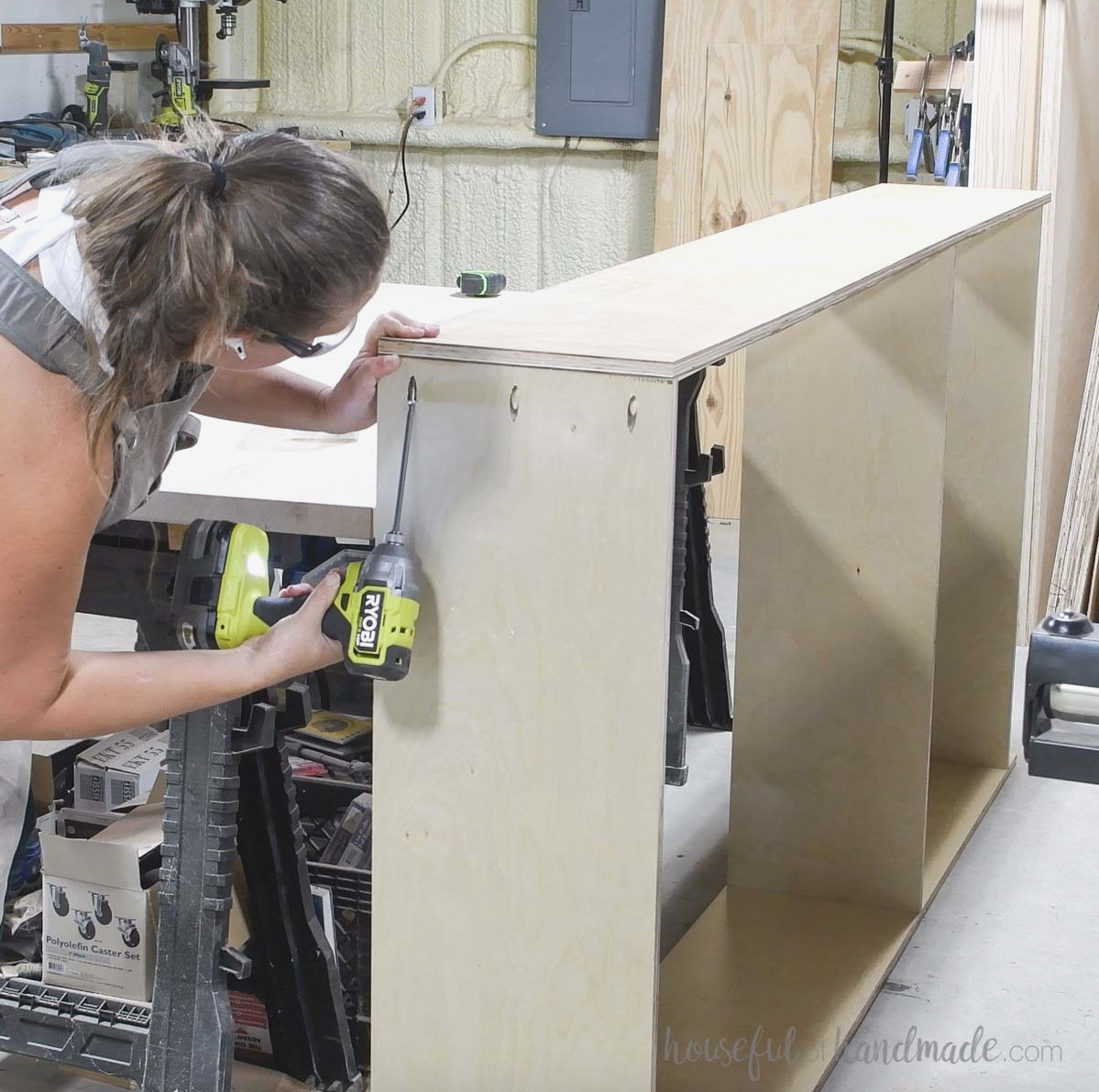 Attaching the second side panel to the bookcase.
