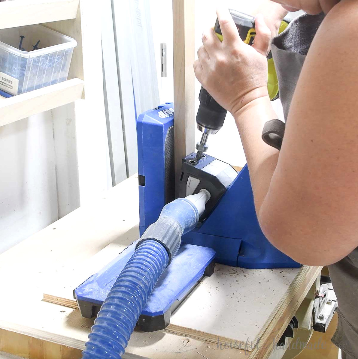 Drilling pocket holes in the 1x2 front frame boards.