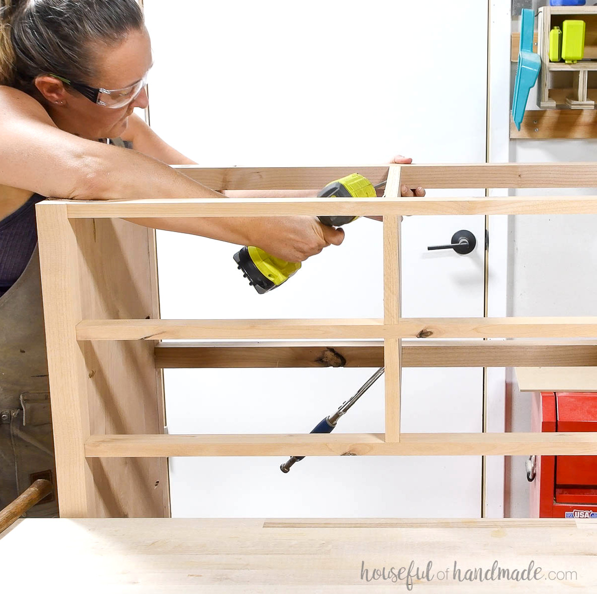 Attaching a center piece of plywood between the face frame on the top.