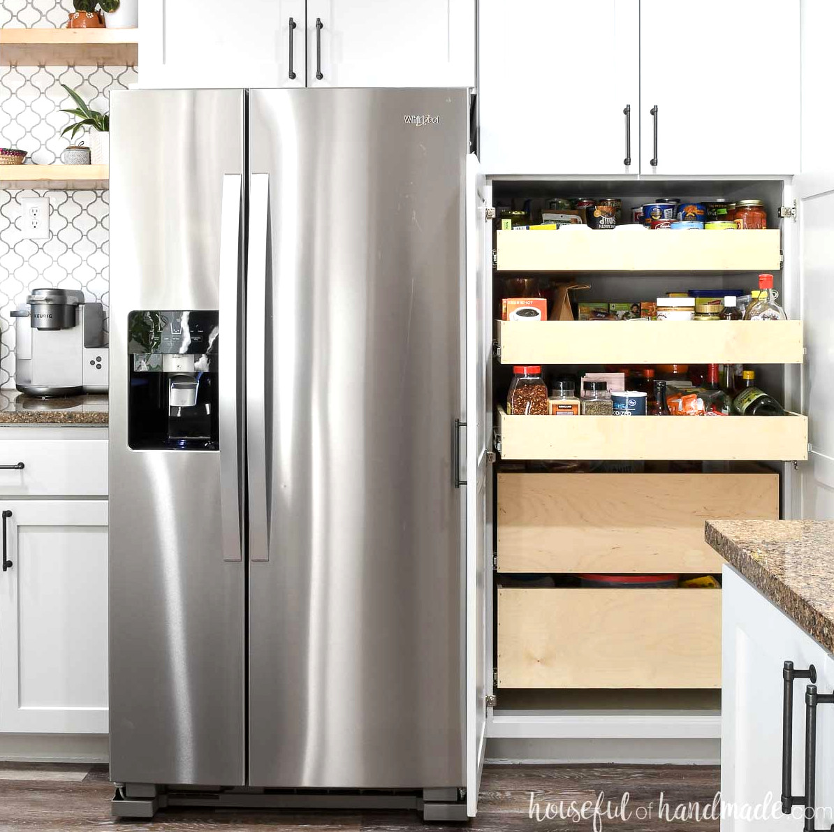 DIY pantry cabinet arranged with 3 shallow pull out shelves and 2 deep pantry drawers.