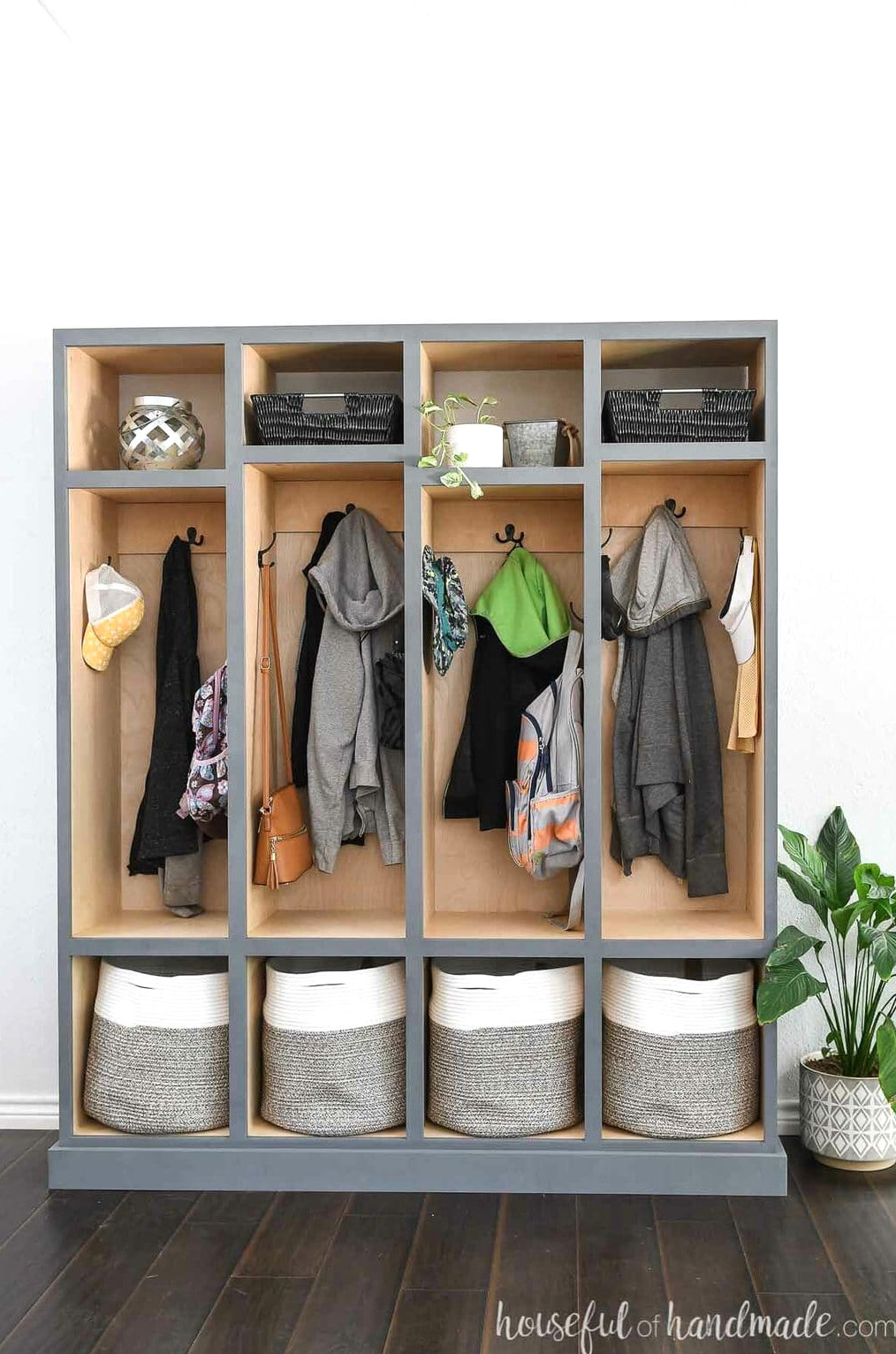 Front-facing view of the mudroom lockers with a nearby plant.