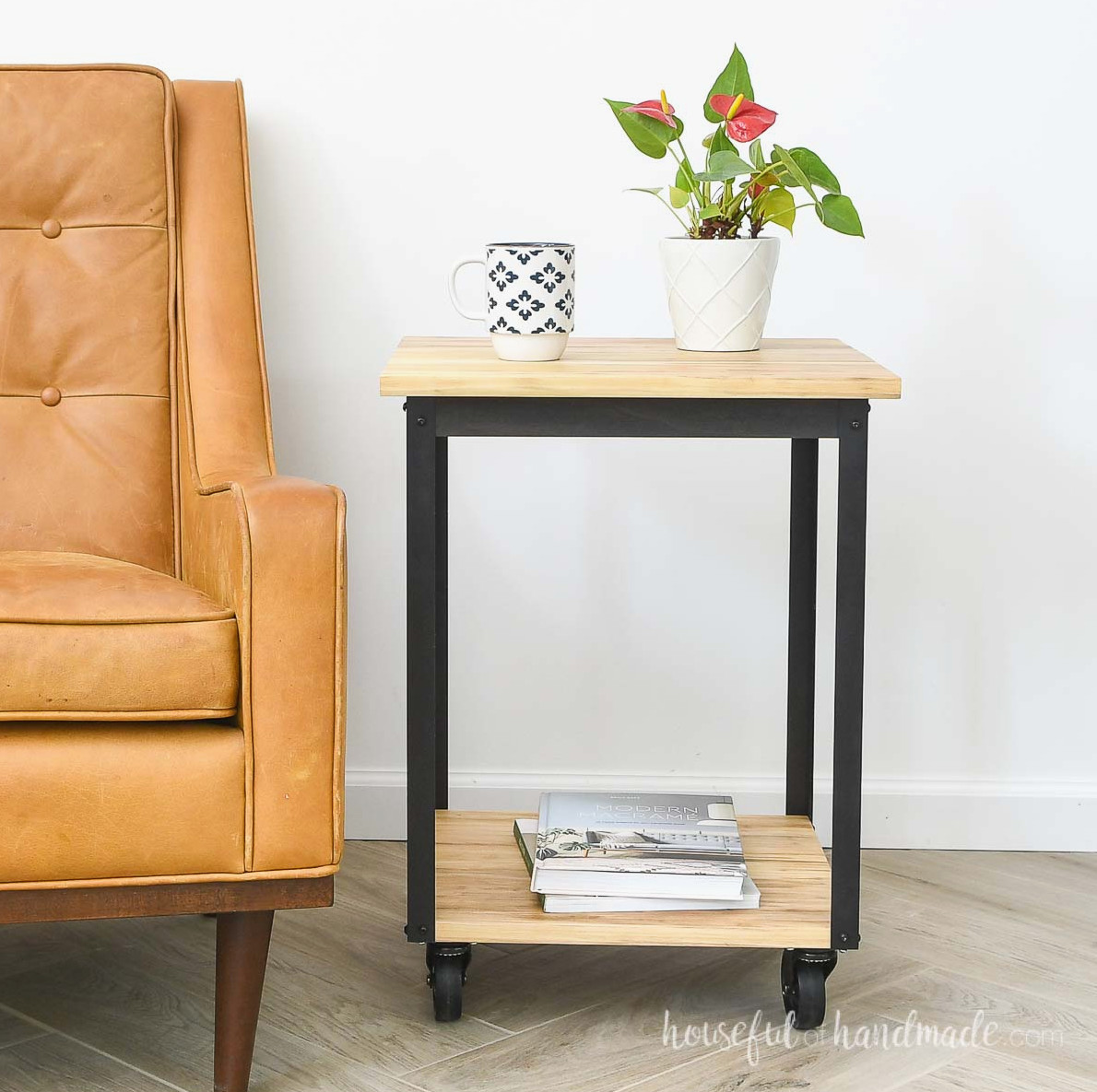 DIY wheeled side table with a metal frame beside a chair.