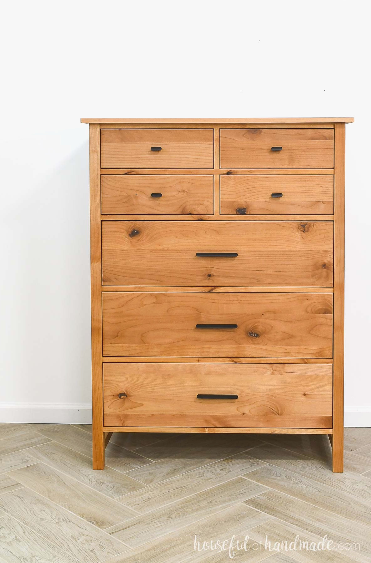 Tall dresser with 4 small drawers and 3 large drawers built from alder wood.