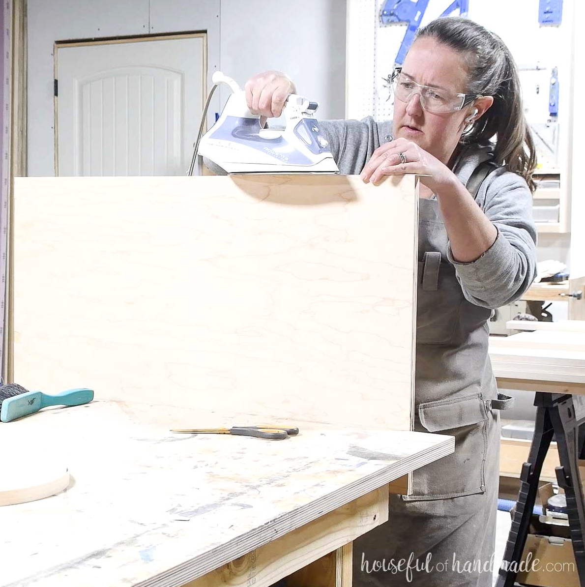 Pressing edge banding onto the edge of plywood. 