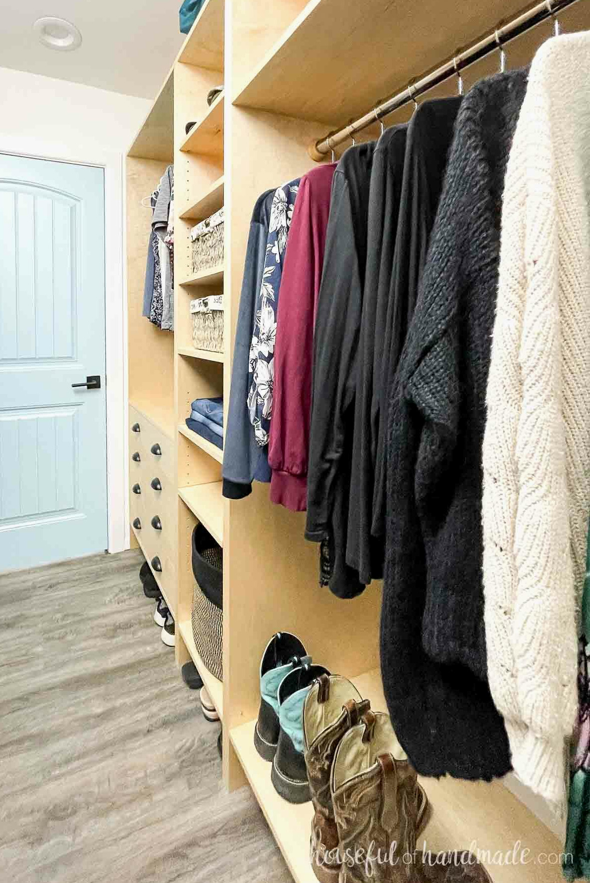 Custom maple plywood closet cabinets installed in a narrow space with numerous shelves and drawers. 