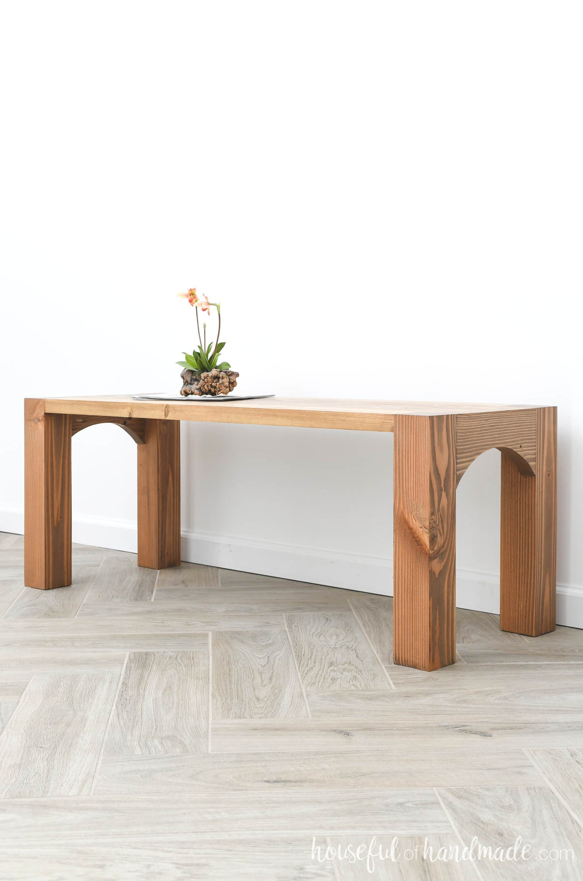 Simple coffee table with chunky legs stained medium brown.