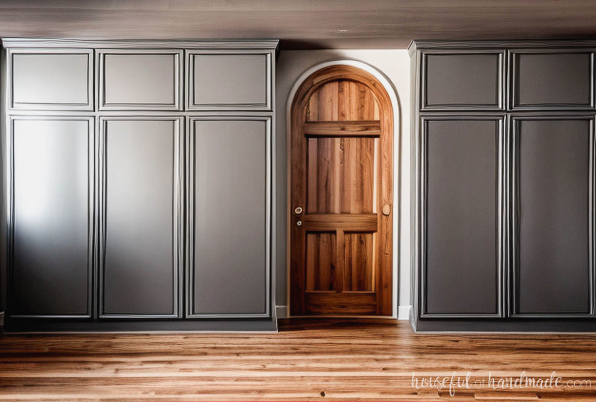 Wall of pantry cabinets around an arched doorway.