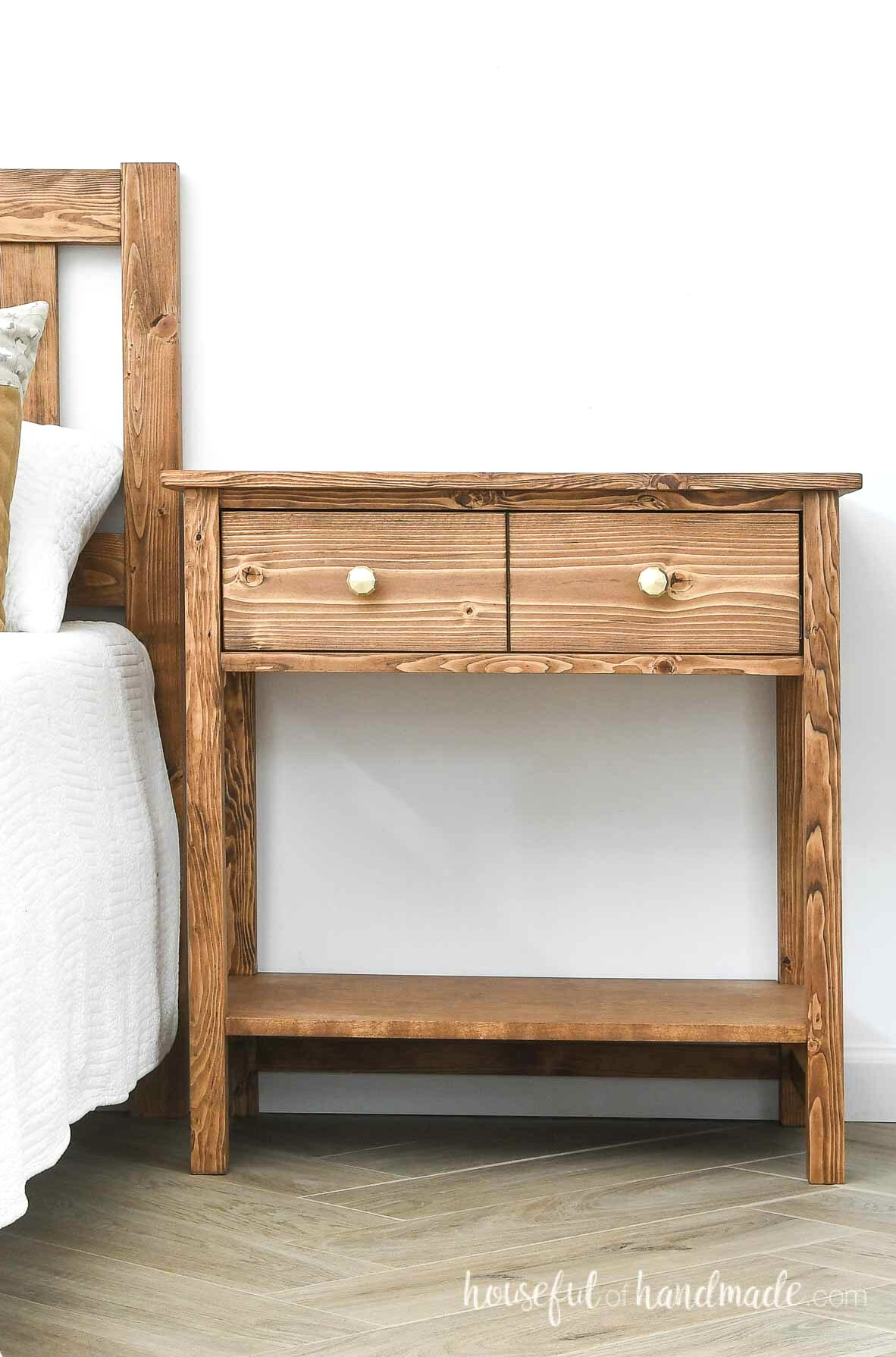 Large nightstand with one drawer and gold drawer pulls.
