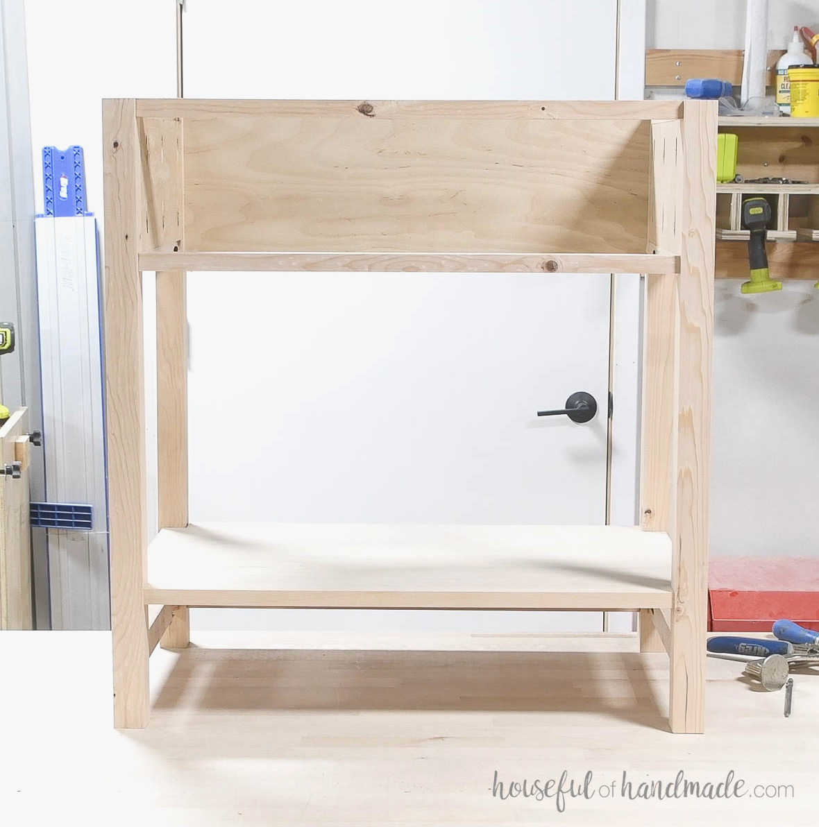Completed nightstand base resting on the workbench.