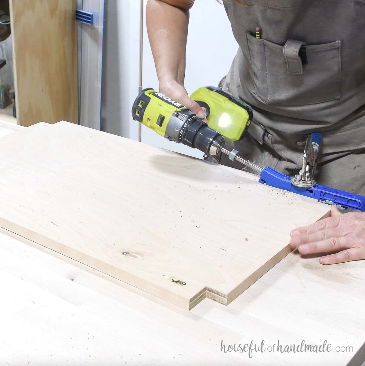 Creating pocket holes in the bottom shelf.
