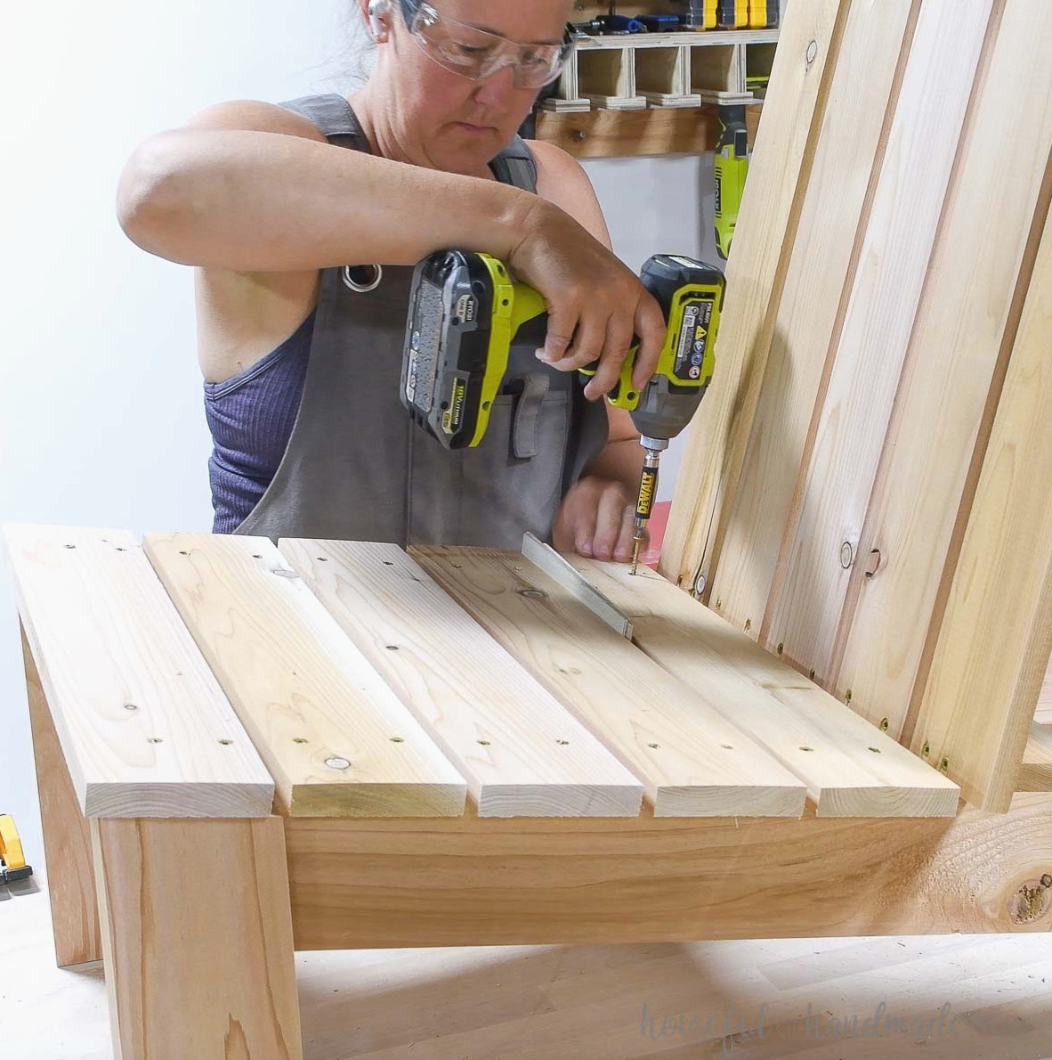 Installing the last seat slat on the modern adirondack chair.