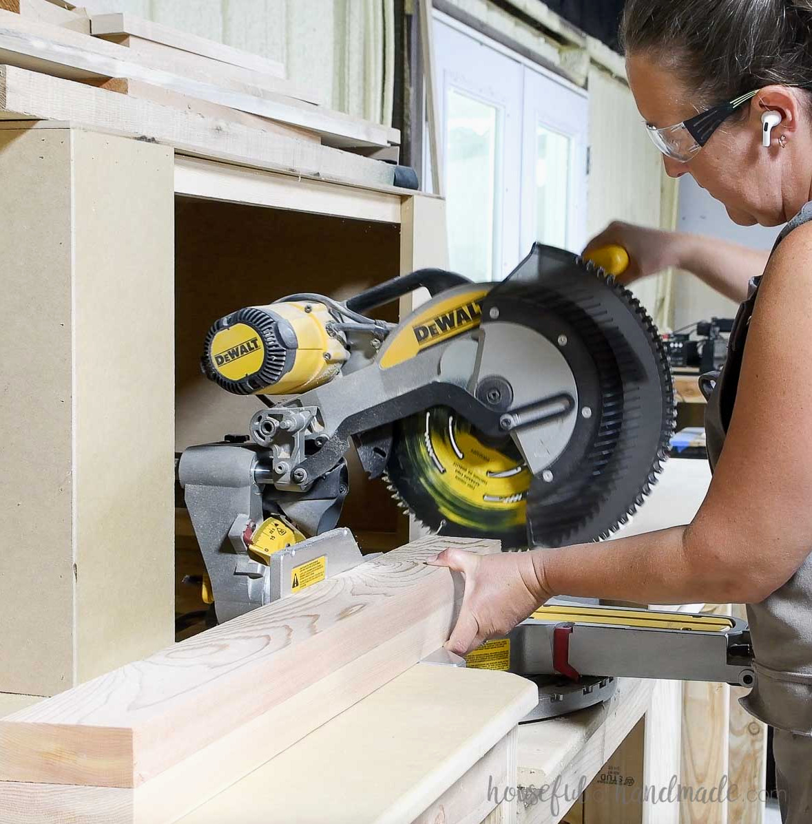 Creating angled cuts on the under-seat boards with the miter saw.