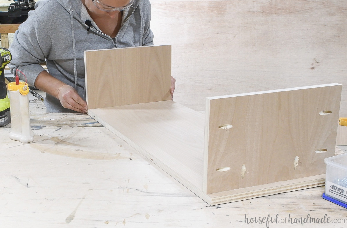 Attaching the cubby sides to the cubby lower shelf. 