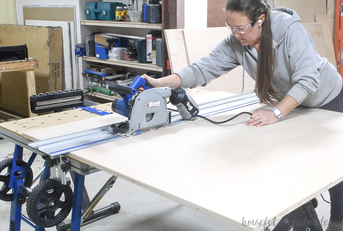 Using a track saw to cut plywood for the display cabinet. 