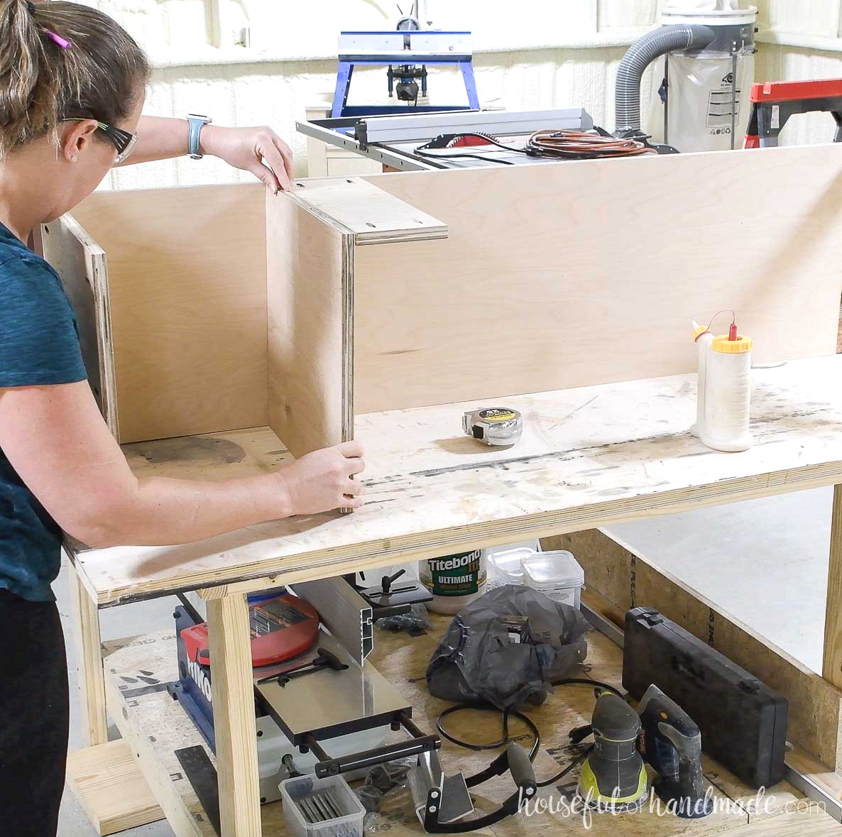 Sliding a shelf into the dado above the support piece. 