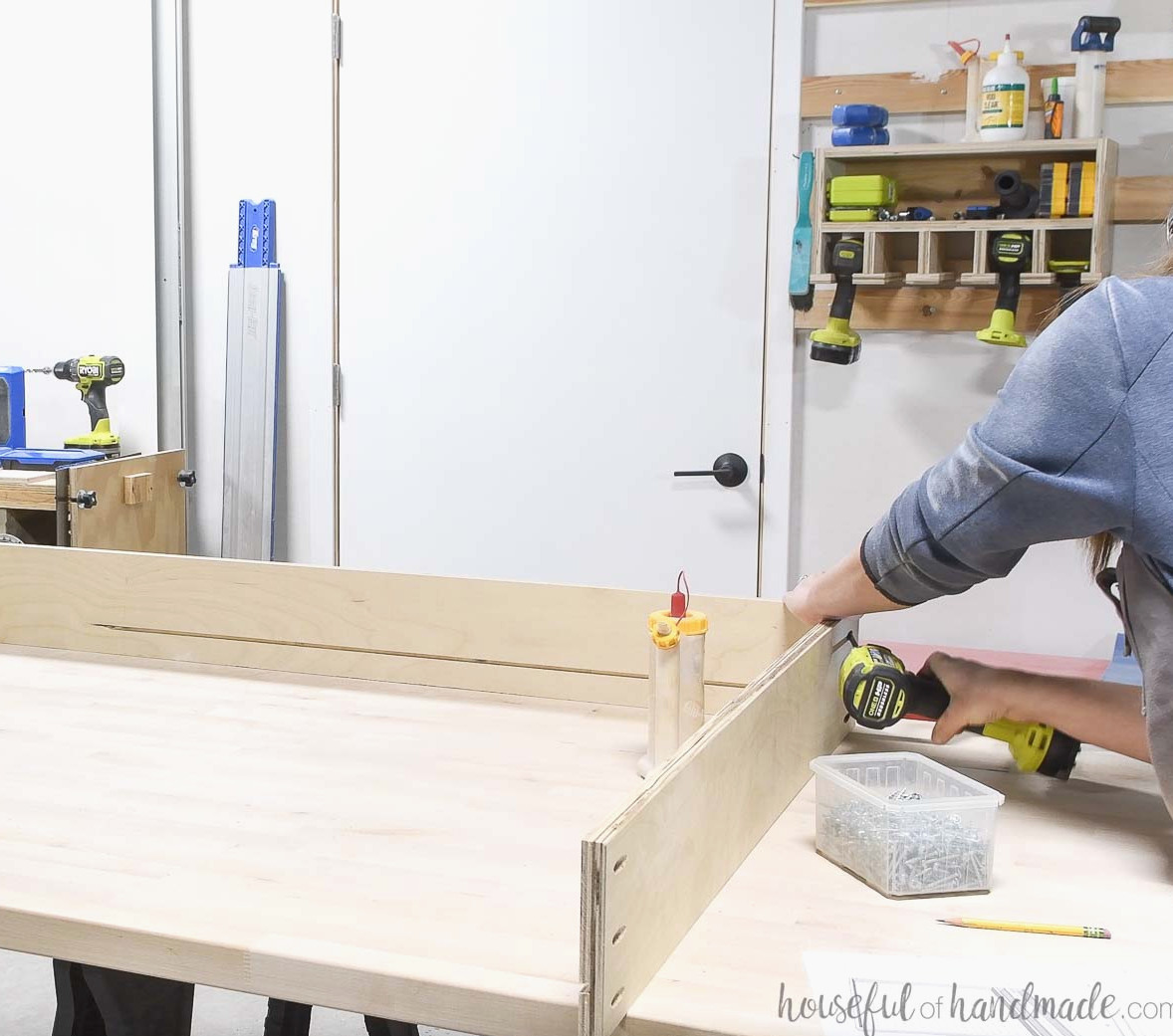 Assembling the pegboard cabinet.