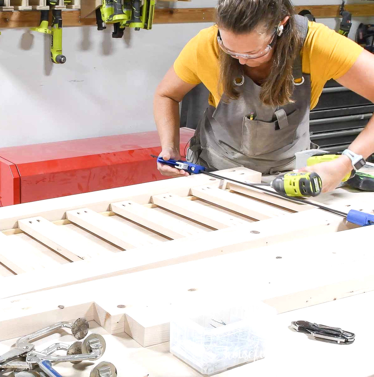 Attaching the headboard slats between the rails.