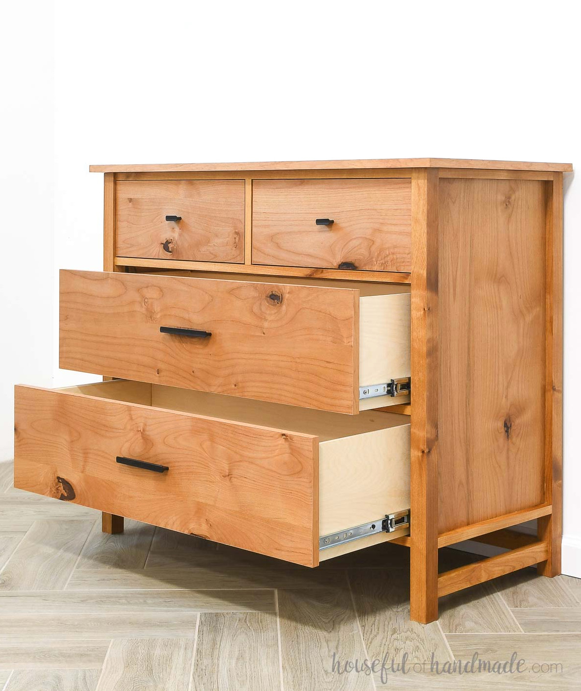 Alder dresser with 4 drawers and the two large bottom drawers open.