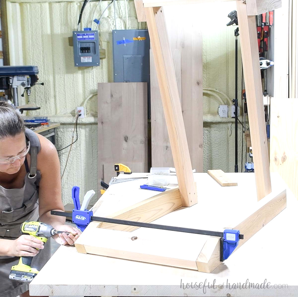 Fastening the back piece to the large DIY outdoor chair.